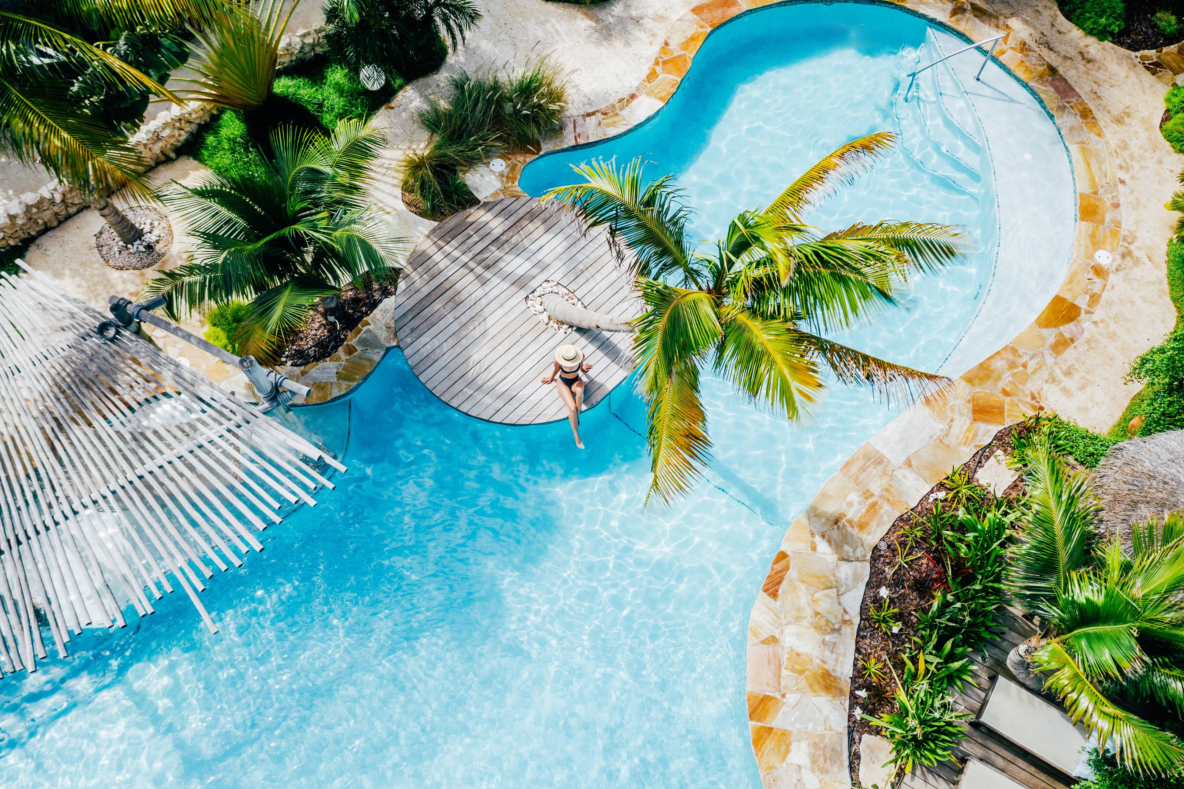 Tropical pool and casitas at Boardwalk Boutique Hotel Aruba — official photography