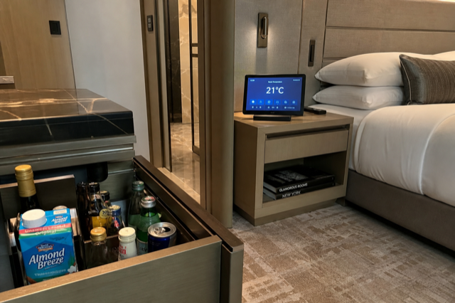VIP suite with almond milk in minibar, temperature set to 21°C, no floral arrangements